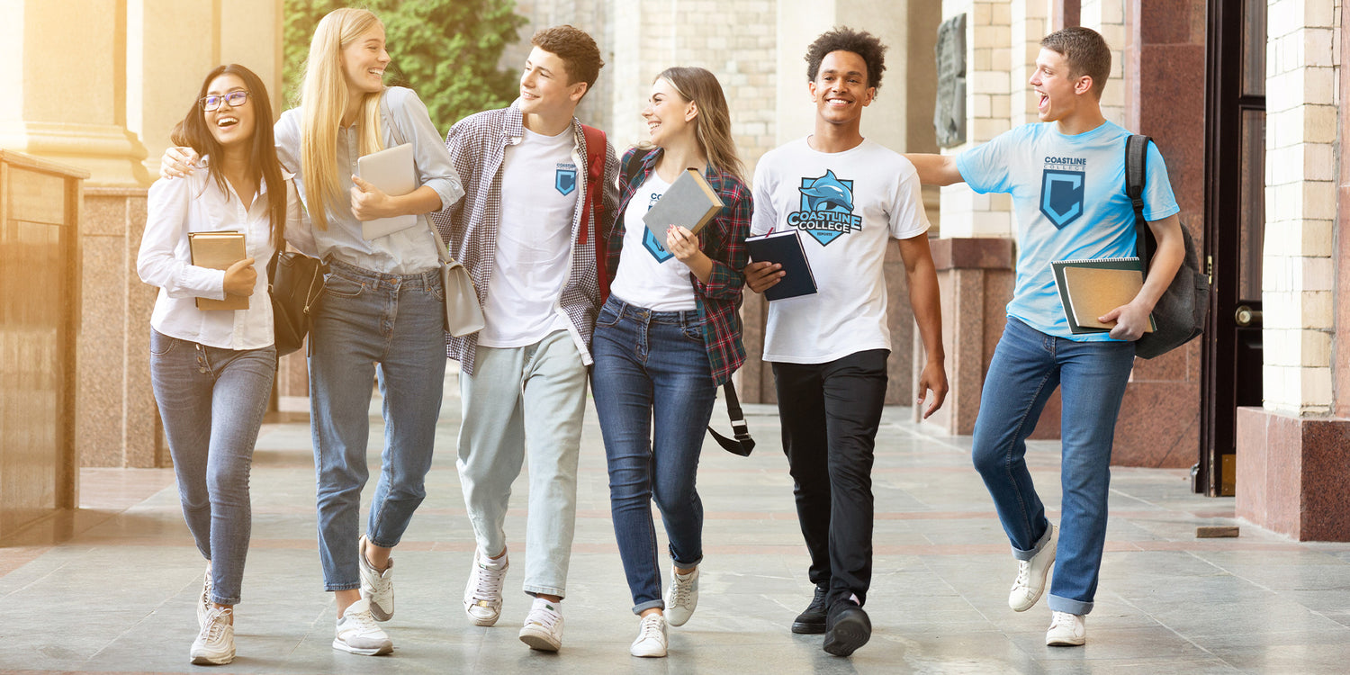 group of college friends walking to class wearing Coastline t-shirts
